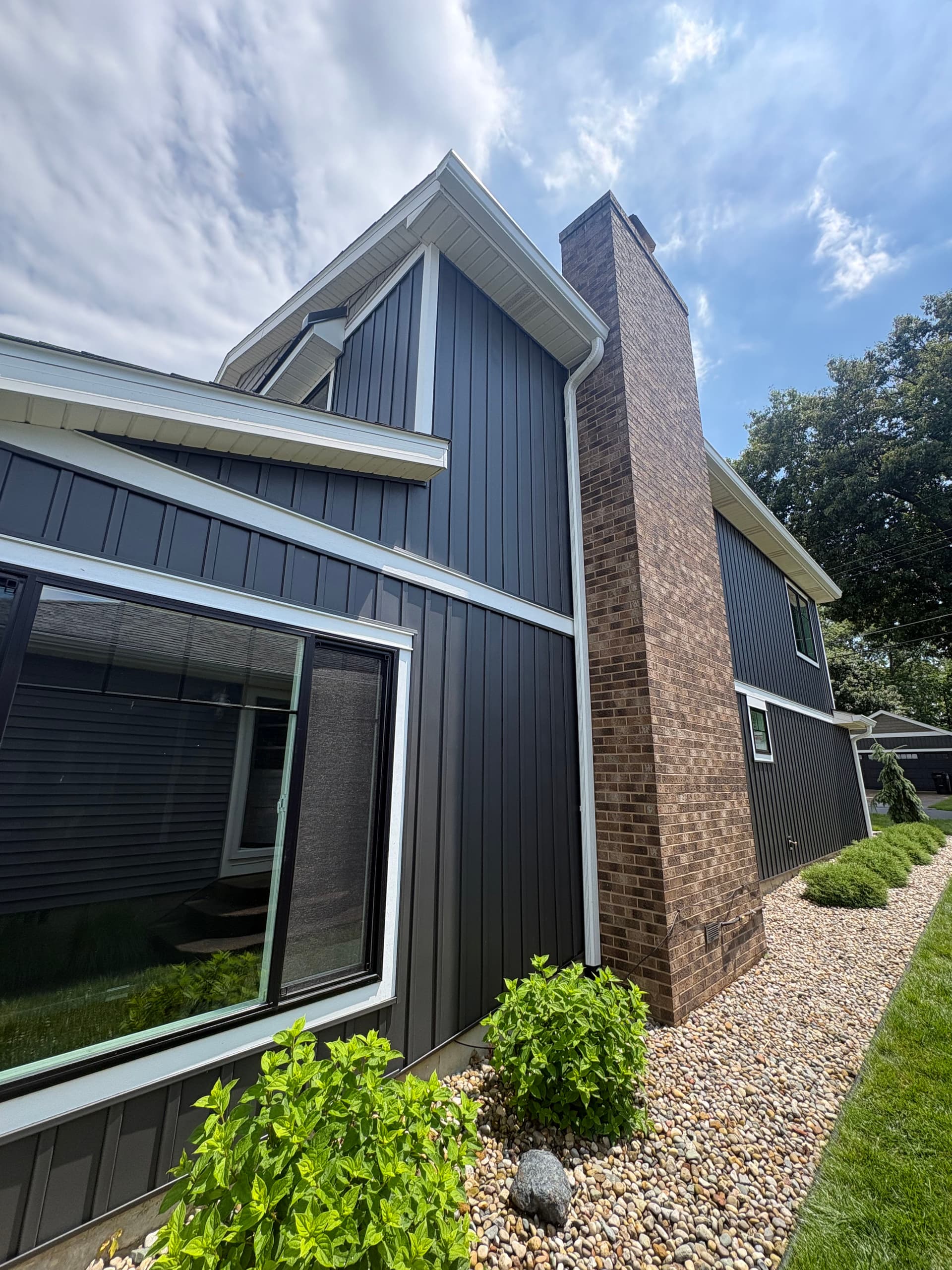 Gallery photos for Dark Board and Batten Siding and Gutter Install on a Lakefront Home: Image #6