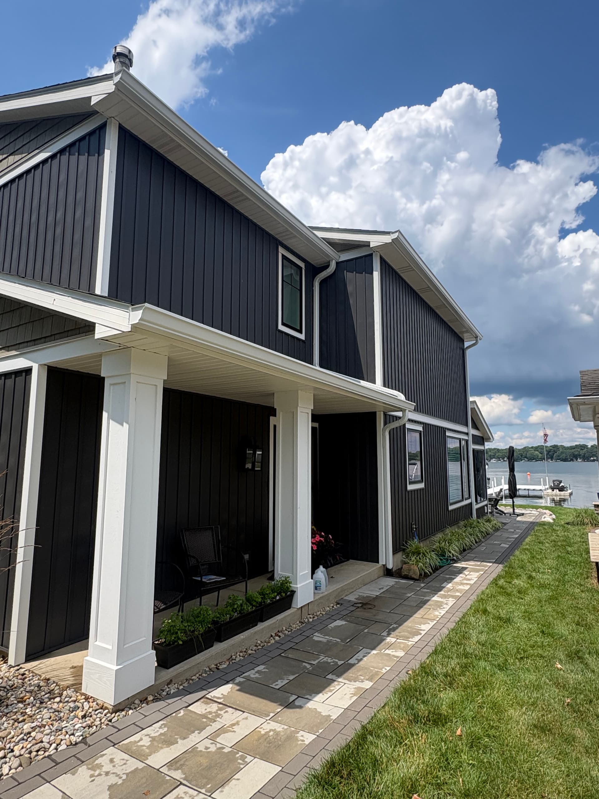 Gallery photos for Dark Board and Batten Siding and Gutter Install on a Lakefront Home: Image #4