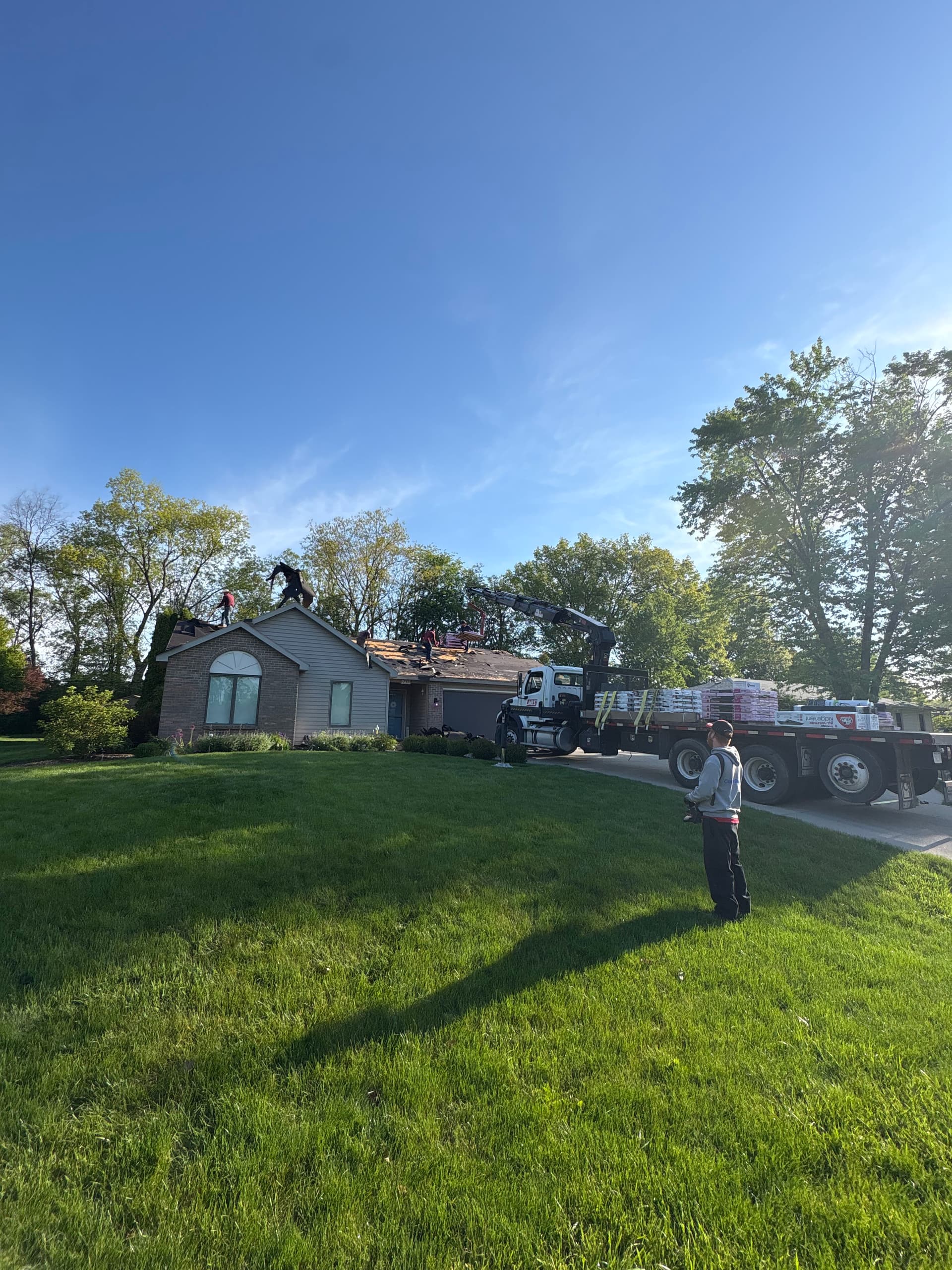 Owens Corning Driftwood Shingles and Pebblestone Clay Gutters Done Right image