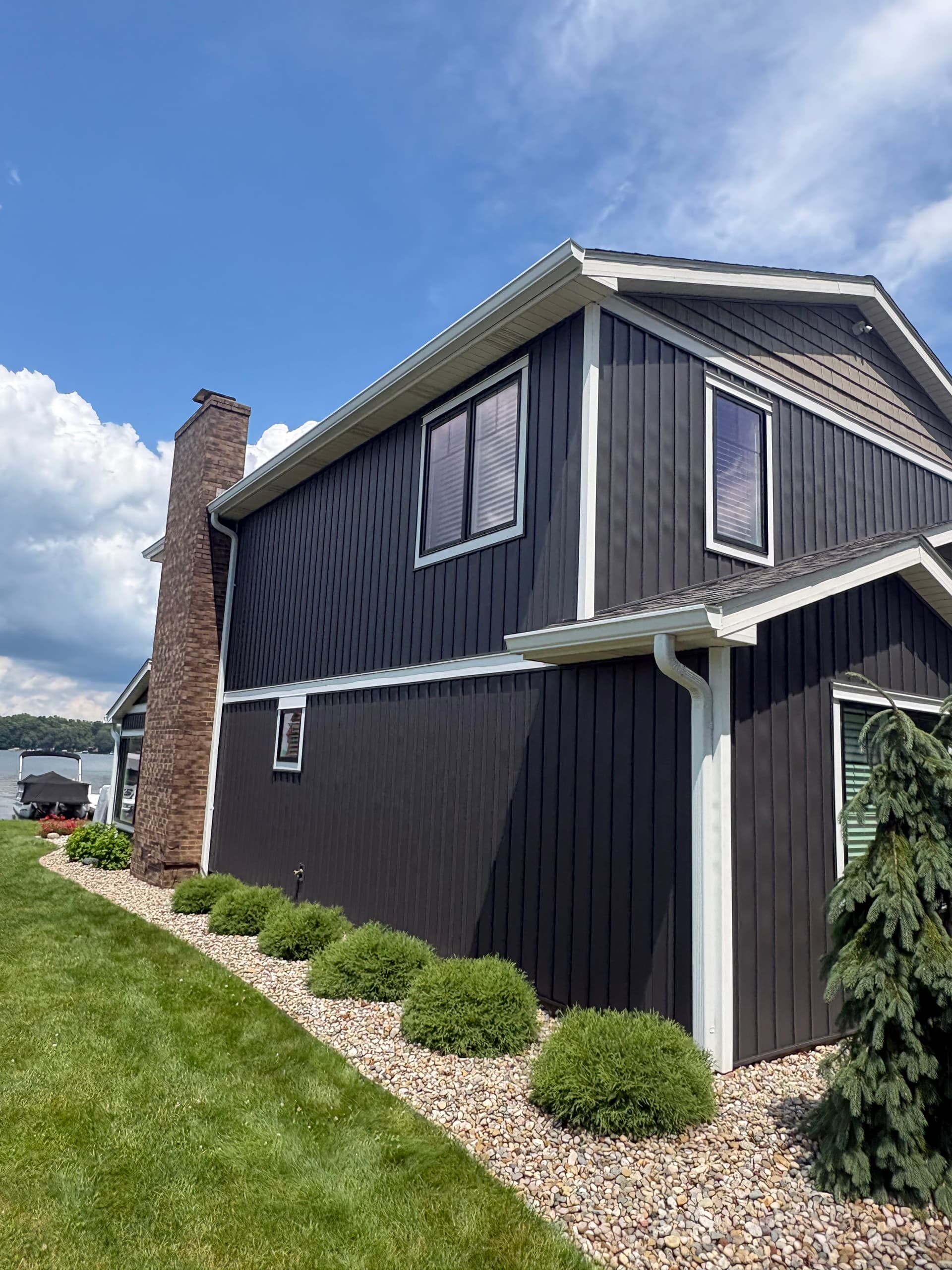 Gallery photos for Dark Board and Batten Siding and Gutter Install on a Lakefront Home: Image #1