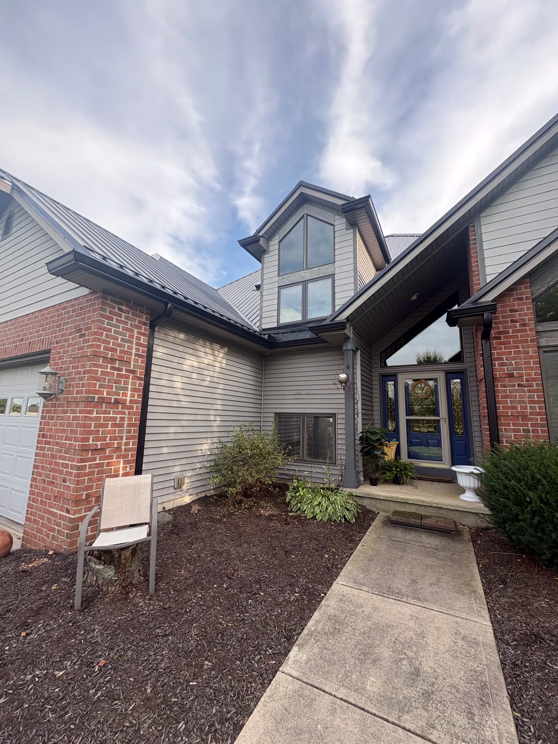 Black 6-Inch Gutter Installation Done Right in Leo Indiana