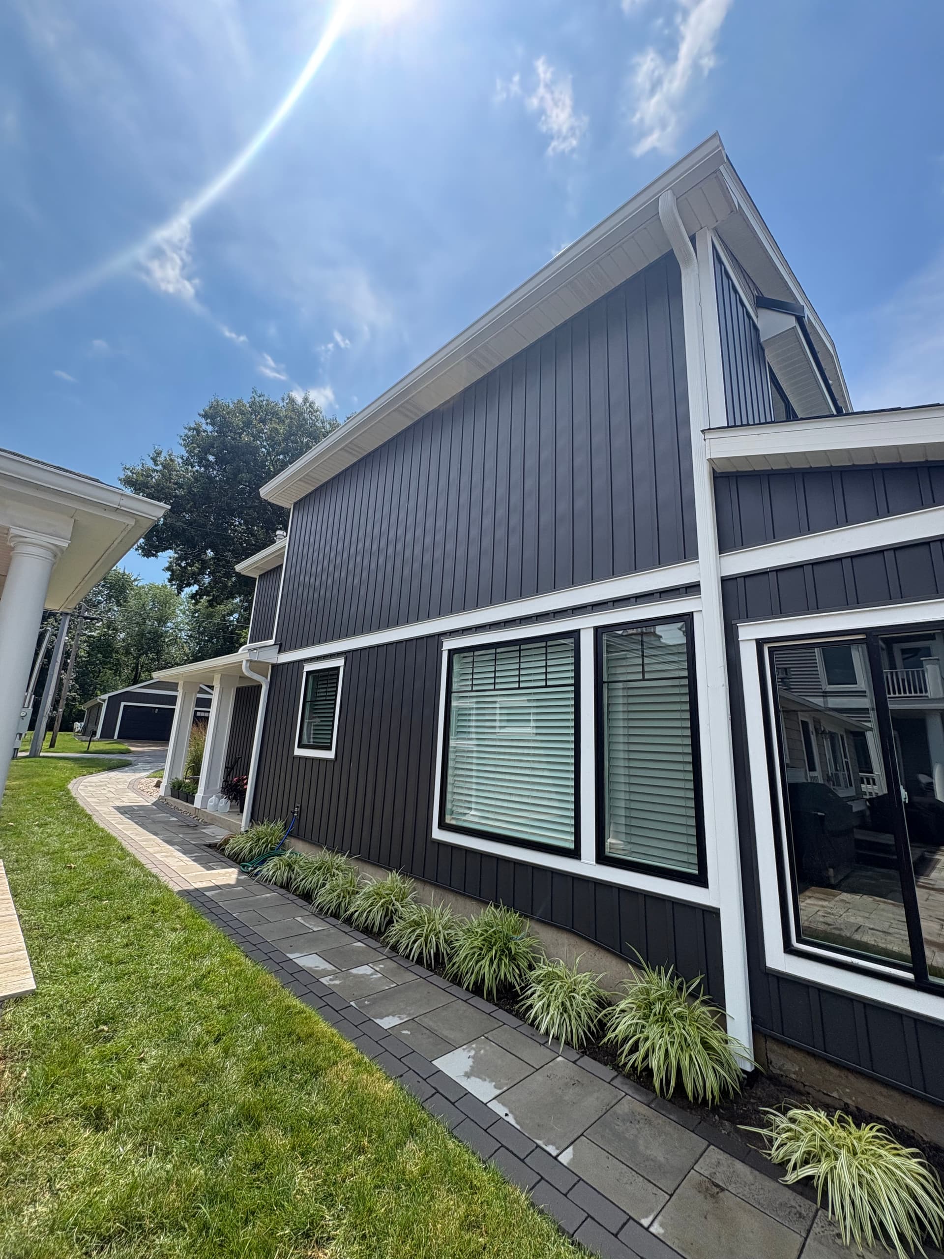 Gallery photos for Dark Board and Batten Siding and Gutter Install on a Lakefront Home: Image #3