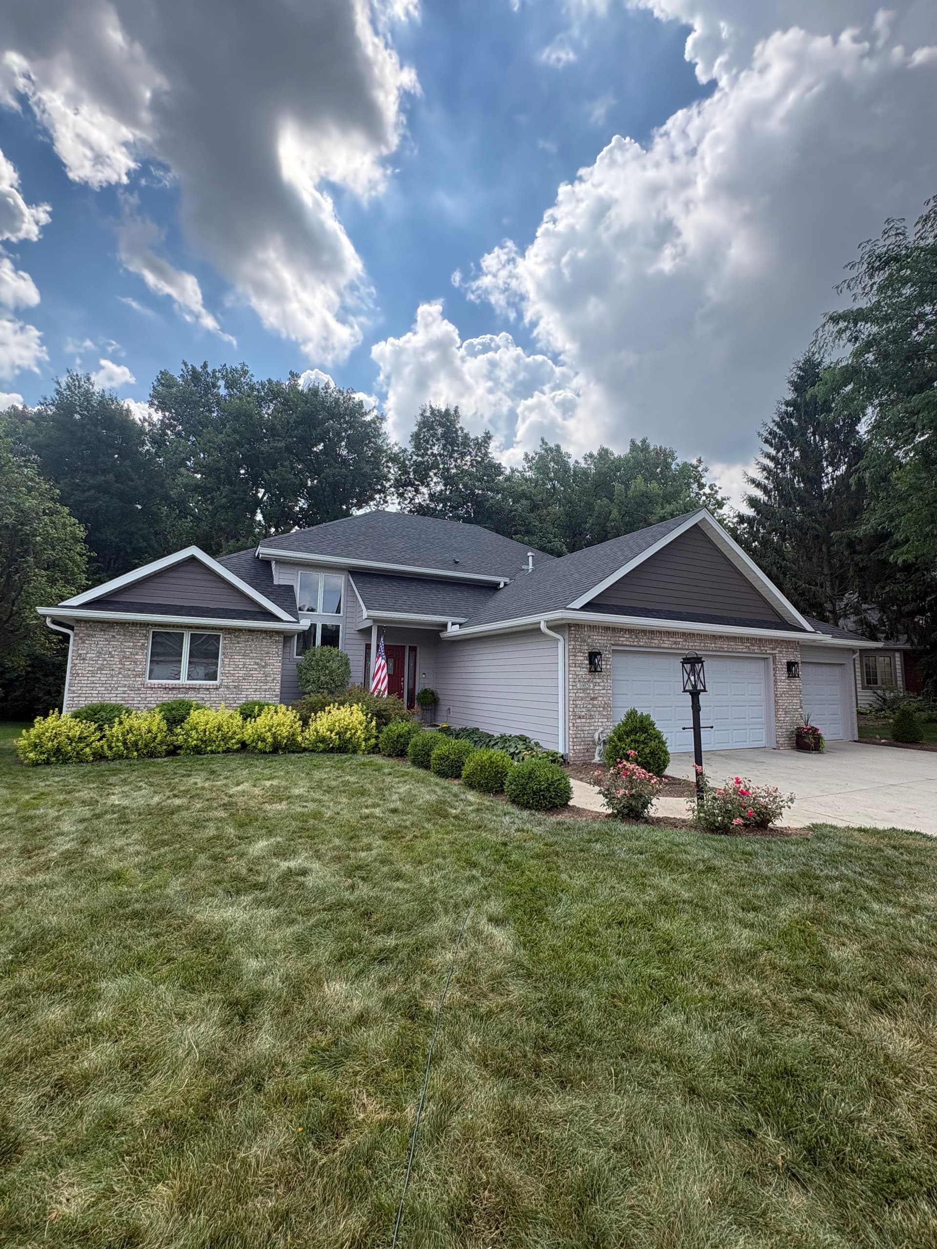 New 30-Year Roof and 6-Inch Gutters Installed on Residential Home image